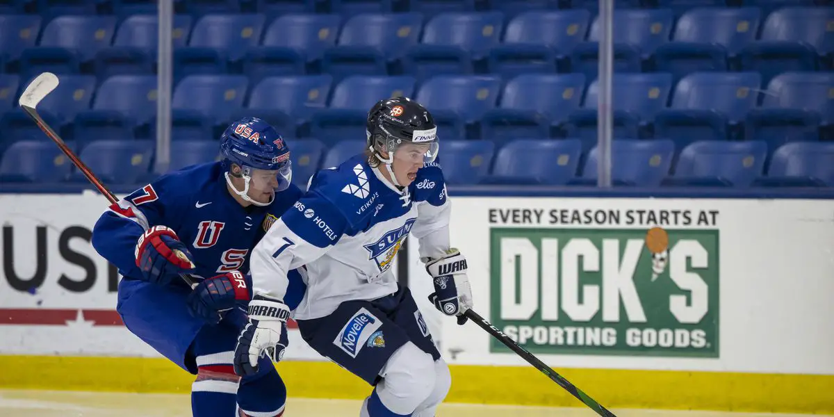 Topi Niemela shields the puck