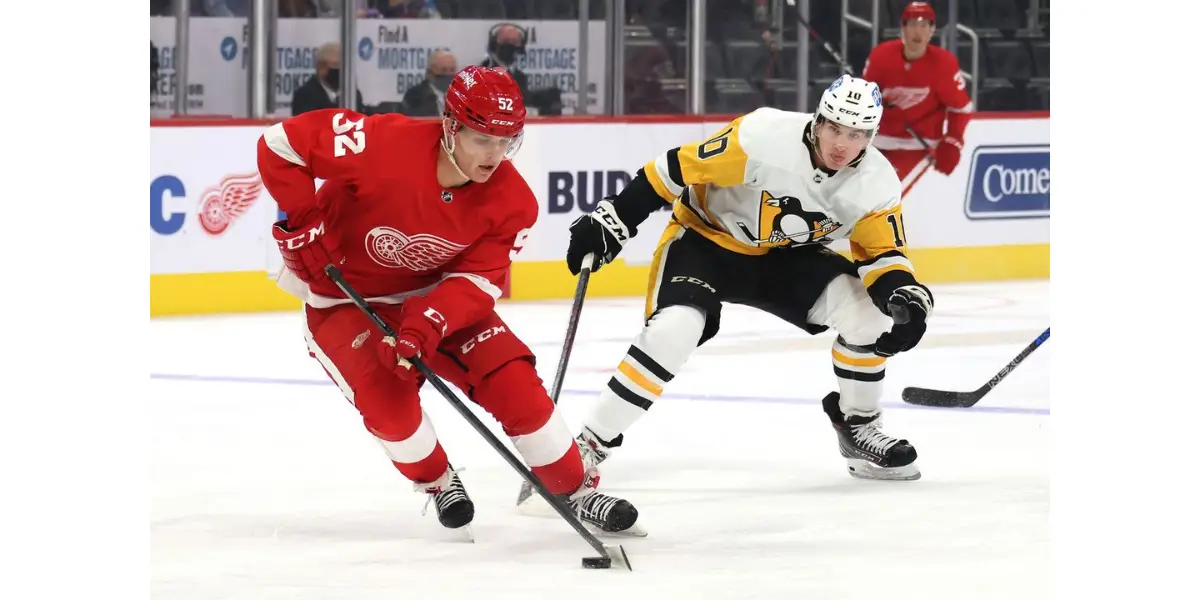 Jonatan Berggren carries the puck through the neutral zone