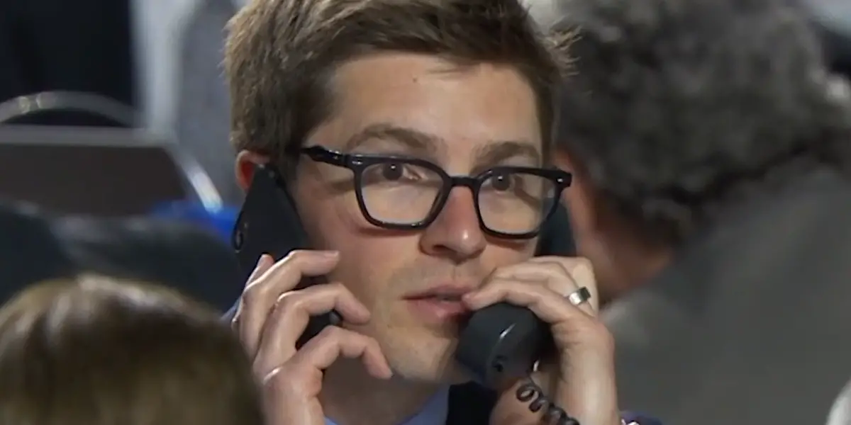 Kyle Dubas working the phones on the draft floor