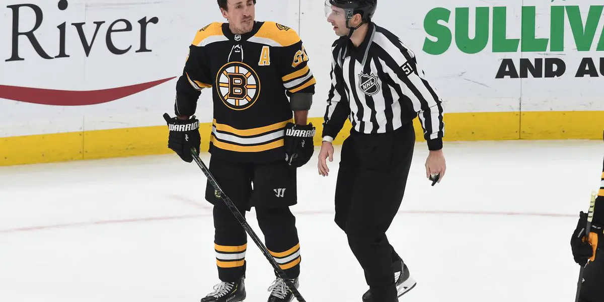 Watch: Bizarre Accident Results in Referee Taking Down Bruins Forward Brad  Marchand - EssentiallySports