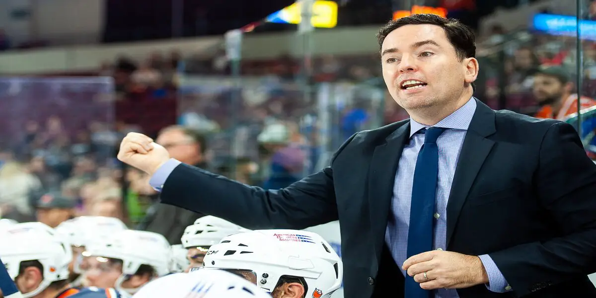 Edmonton Oilers coach Jay Woodcroft stands behind the bench during