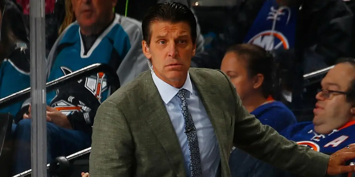 Lane Lambert behind the bench during an Islanders game