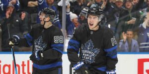 Mitch Marner and Michael Bunting celebrating in Leafs alternate jerseys