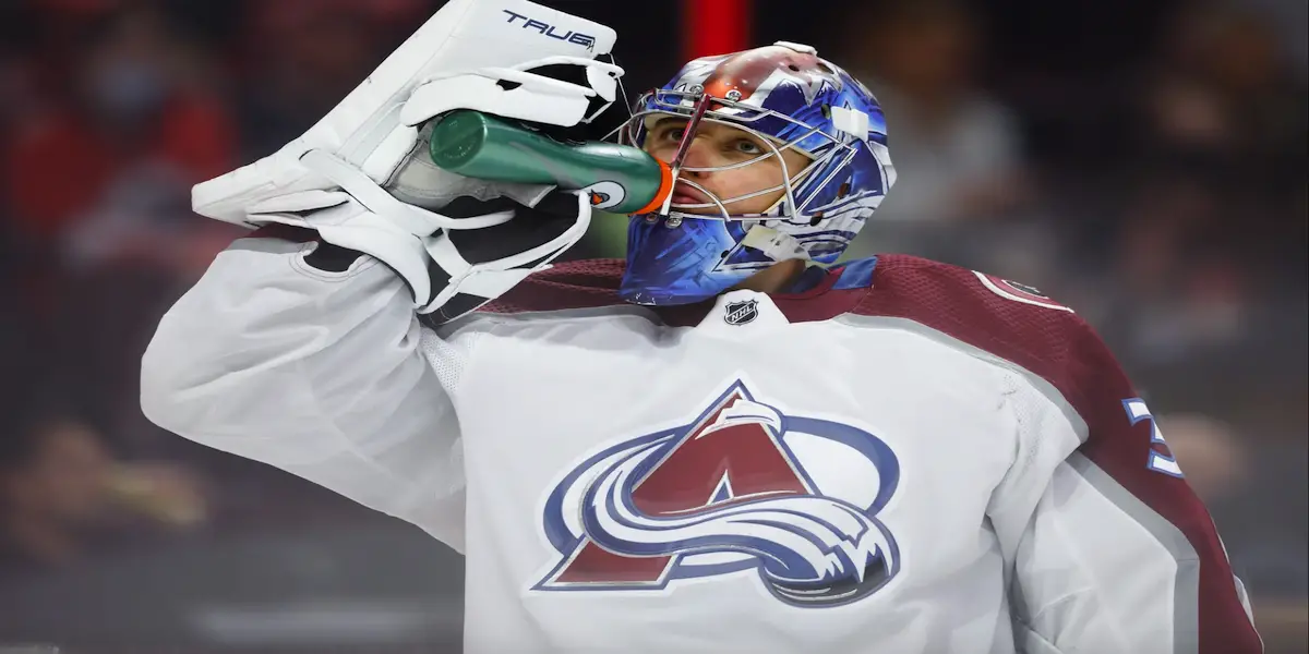 Jonas Johansson takes a swig of water in a Avalanche away uniform