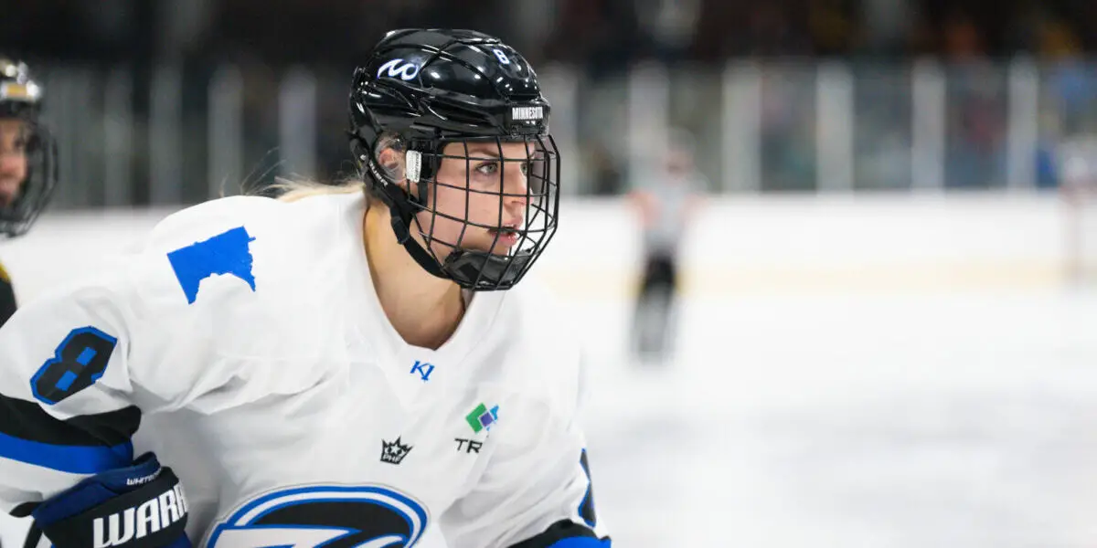 Minnesota Whitecaps forward Natalie Snodgrass skates wearing her home white jersey with the Whitecaps crest during their home opener against the Boston Pride on November 18, 2022.