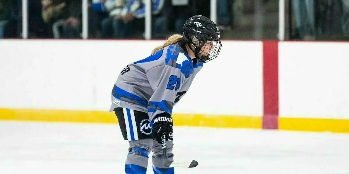 Minnesota Whitecaps forward Liz Schepers stands alone during game action wearing her #21 grey alternate jersey.