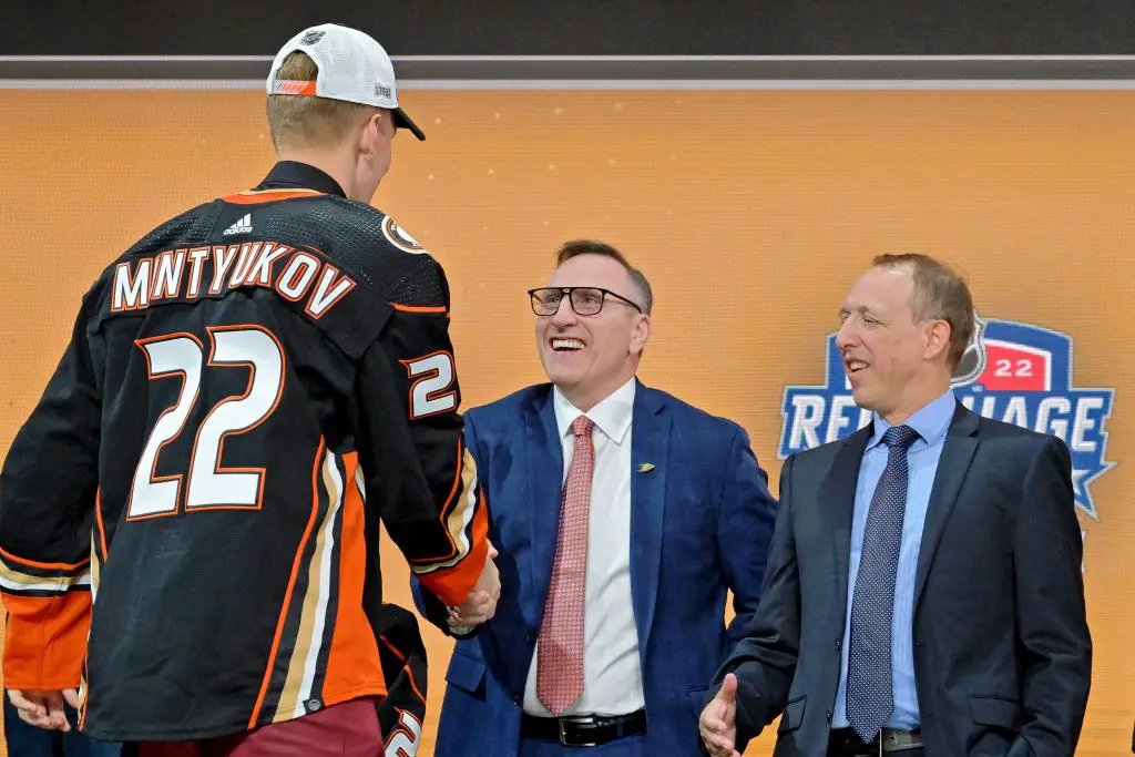 Pat Verbeek shaking Pavel Mintyukov's hand. 