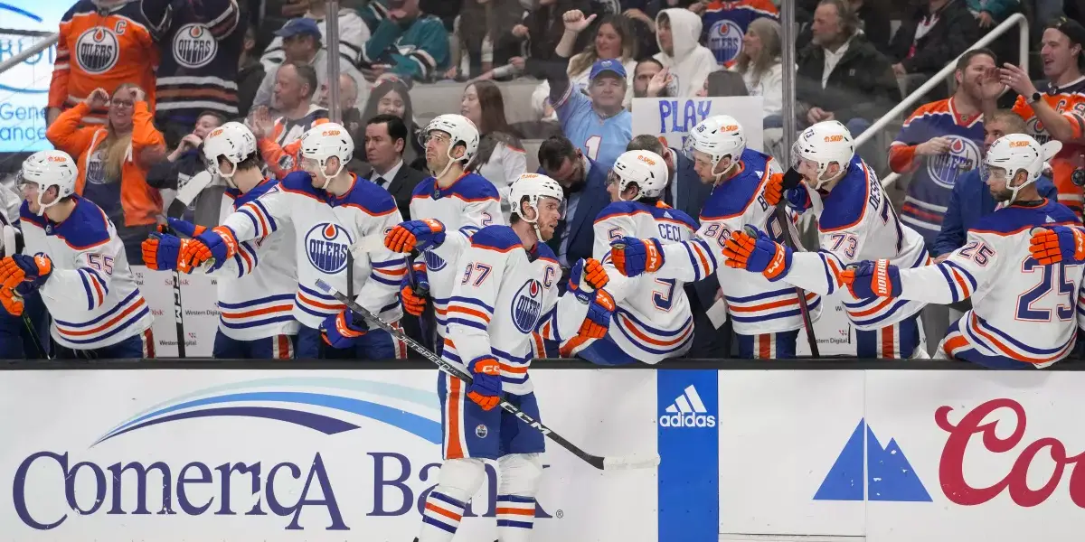 Birthday boy Connor McDavid (97) gets love from his teammates after scoring a goal during the first period in a game against the San Jose Sharks Jan 13, 2023 (AP Photo/Godofredo A. Vásquez) (Godofredo A. Vásquez / Associated Press)