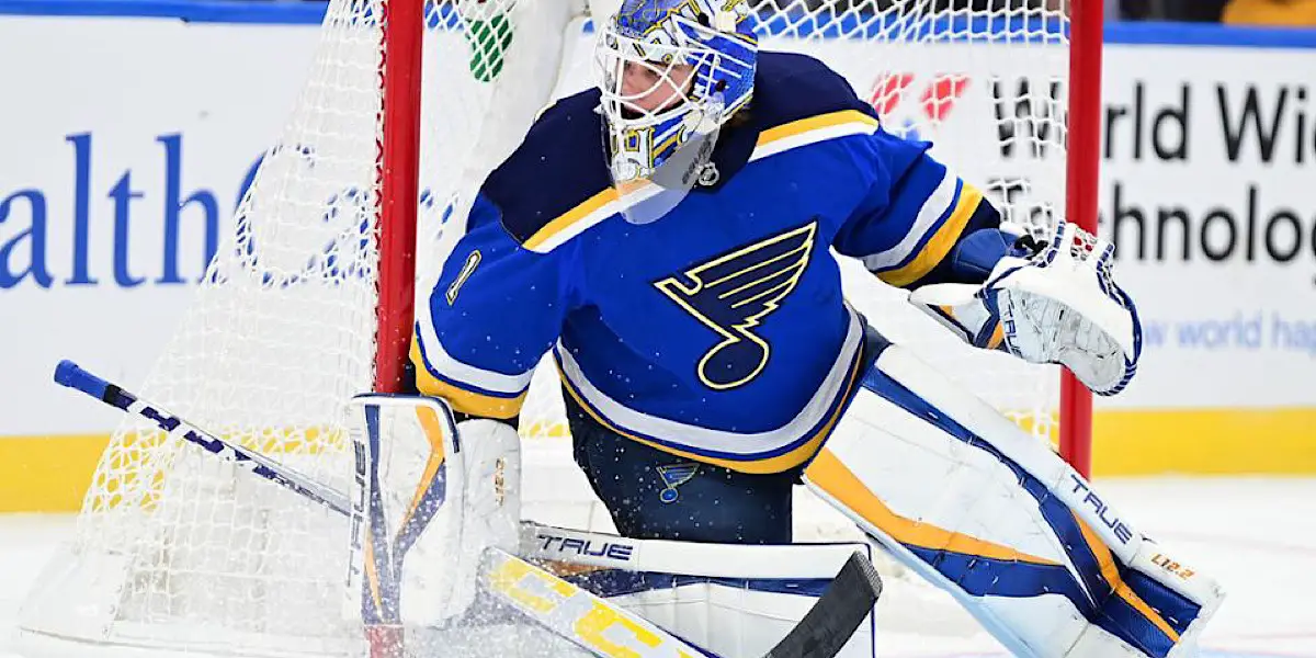 Joel Hofer of the St. Louis Blues deflects the puck with his mask News  Photo - Getty Images