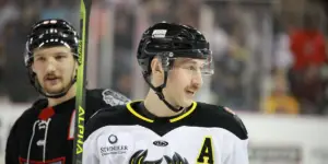 Heartlanders defenseman, Justin Wells with an Indy Fuel player behind his right shoulder.
