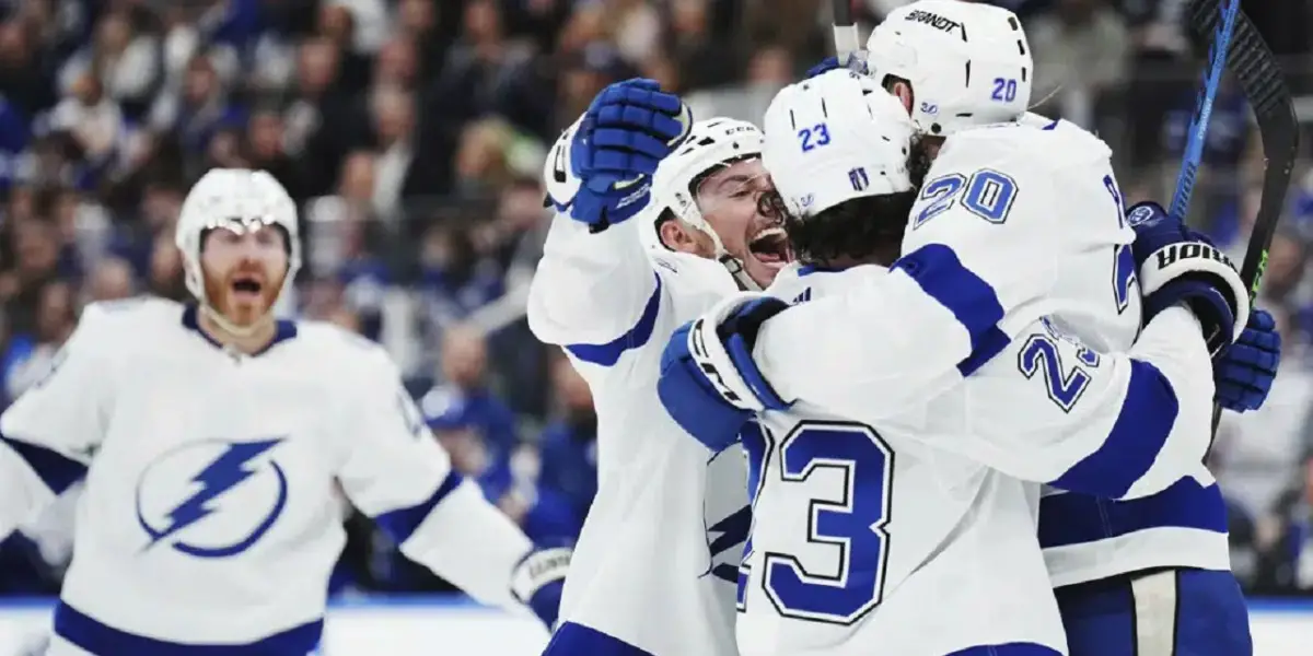 Tampa Bay Lightning forward Nicholas Paul (20) celebrates his goal against the Toronto Maple Leafs with forward Michael Eyssimont (23) and forward Ross Colton (79) during the third period of Game 5 Thursday night in Toronto.