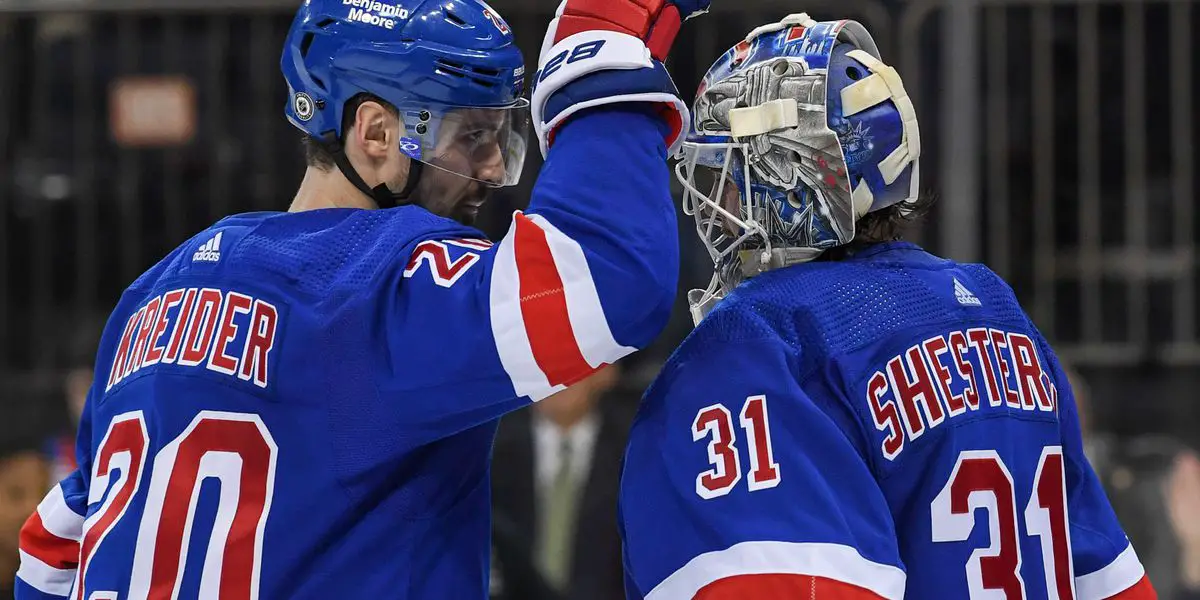 Chris Kreider congratulates Igor Shesterkin on a win