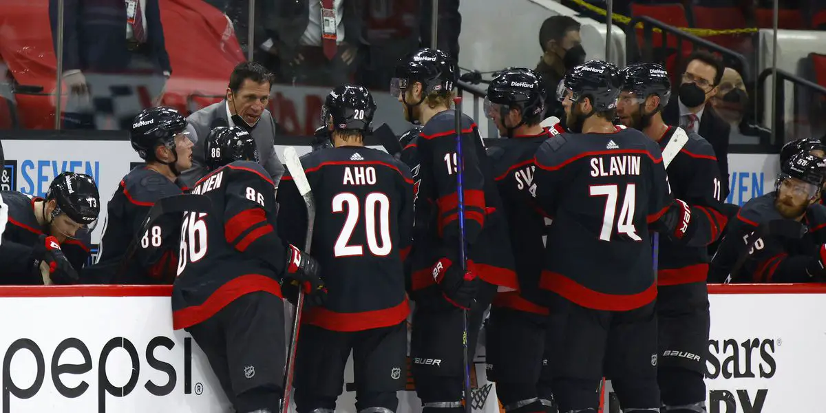 The Carolina Hurricanes by the bench during a timeout in the 2023 Stanley Cup Playoffs