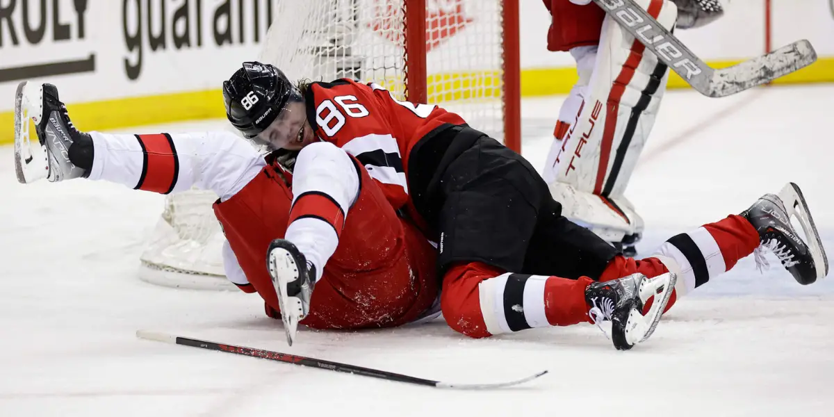 New Jersey Devils center Jack Hughes (86) fights with Carolina Hurricanes center Sebastian Aho during the second period of Game 3 of an NHL hockey Stanley Cup second-round playoff series, Sunday, May 7, 2023, in Newark, N.J. AP Photo/Adam Hunger