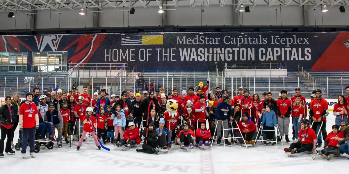 A group photo of the participants in the adaptive skate.