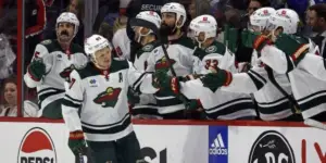 Kirill Kaprizov goes down the handshake line after he scores for the Minnesota Wild during the game in Carolina.