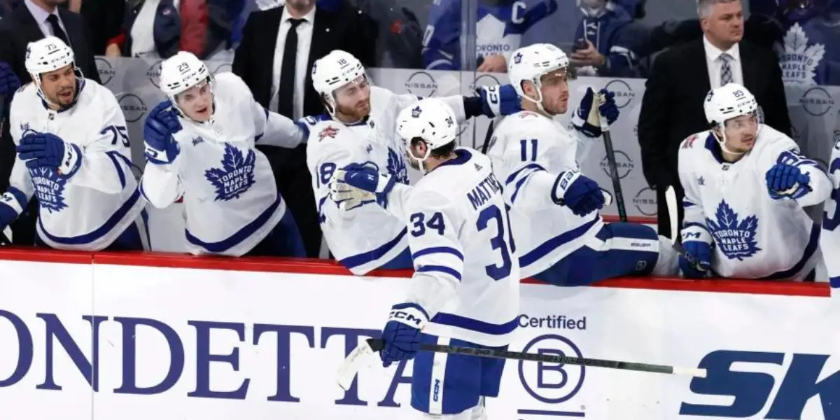 The Toronto Maple Leafs bench celebrating a goal