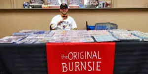 The Original Burnsie behind his table of hockey collectibles.