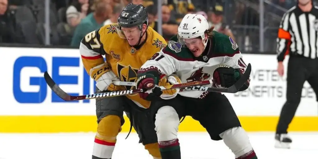 Josh Doan battles for the puck in a preseason game against the Vegas Golden Knights