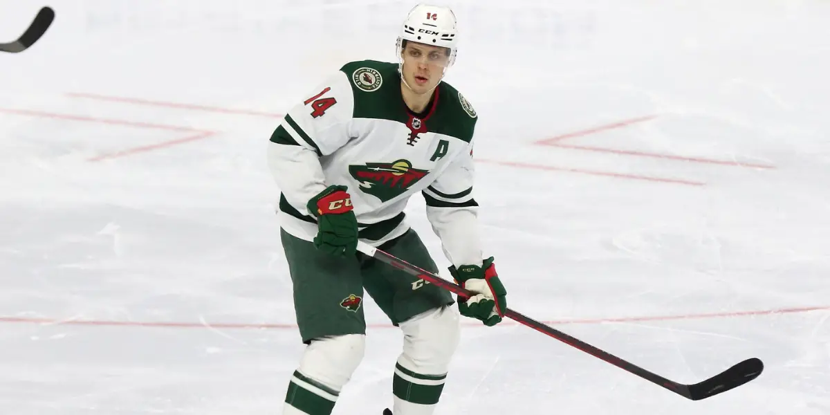 Joel Eriksson Ek on the ice in a white Minnesota Wild jersey