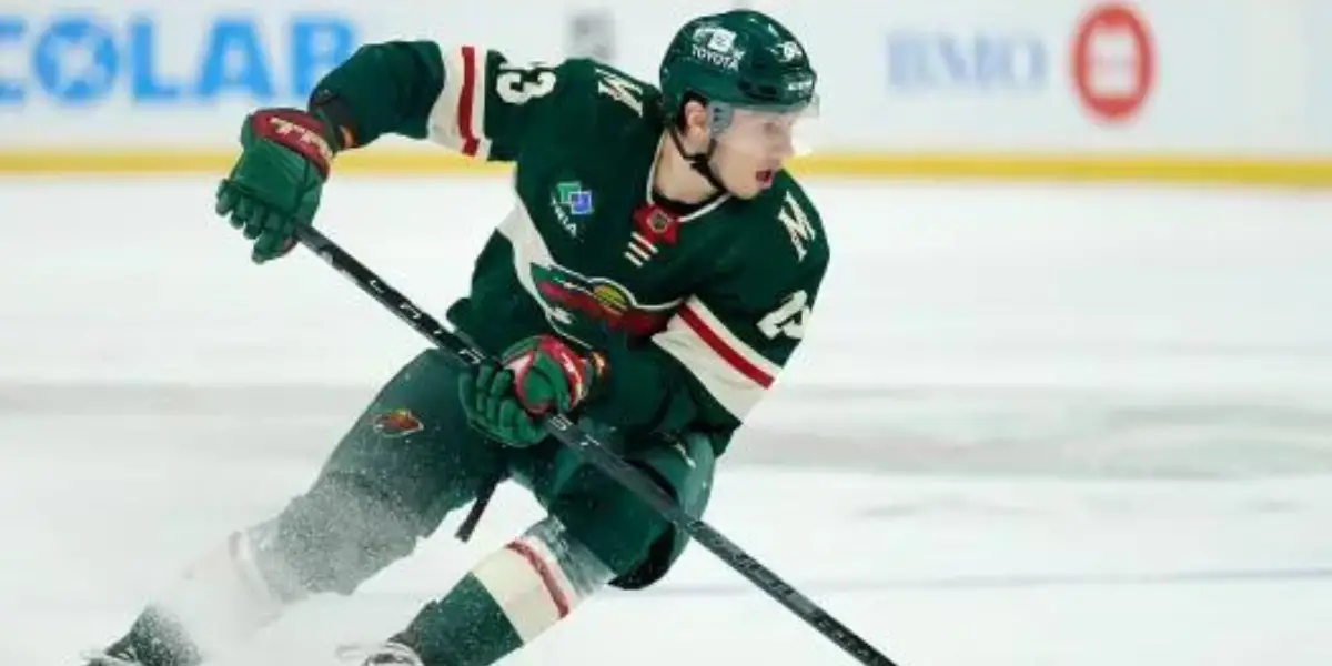 Marco Rossi of the Minnesota Wild skating in a green Wild uniform