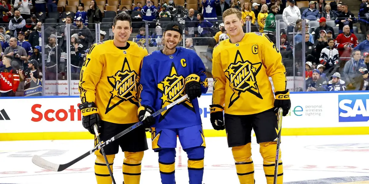 Justin Bieber leans into Sidney Crosby like he fully intents to crop Nathan MacKinnon out of the All-Star Game photo