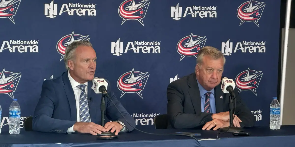 Dean Evason and Don Waddell at a press conference