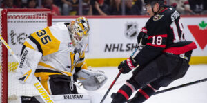 Mar 12, 2024; Ottawa, Ontario, CAN; Pittsburgh Penguins goalie Tristan Jarry (35) makes a save on a shot from Ottawa Senators center Tim Stutzle (18) in the first period at the Canadian Tire Centre. Mandatory Credit: Marc DesRosiers-USA TODAY Sports