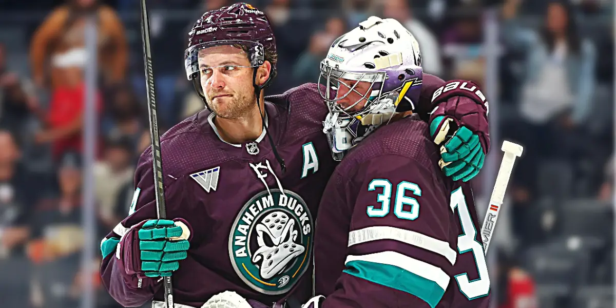 Cam Fowler, defenceman, and John Gibson, goalie hug after win