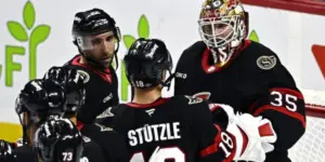 Ottawa Senators Tim Stutzle and Linus Ullmark celebrate a win