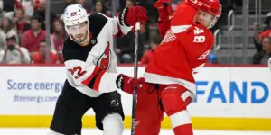 Brett Pesce lays a check in his New Jersey Devils debut.