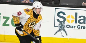 Georgii Merkulov #10 skating for the Providence Bruins in specialty Spiderman jerseys