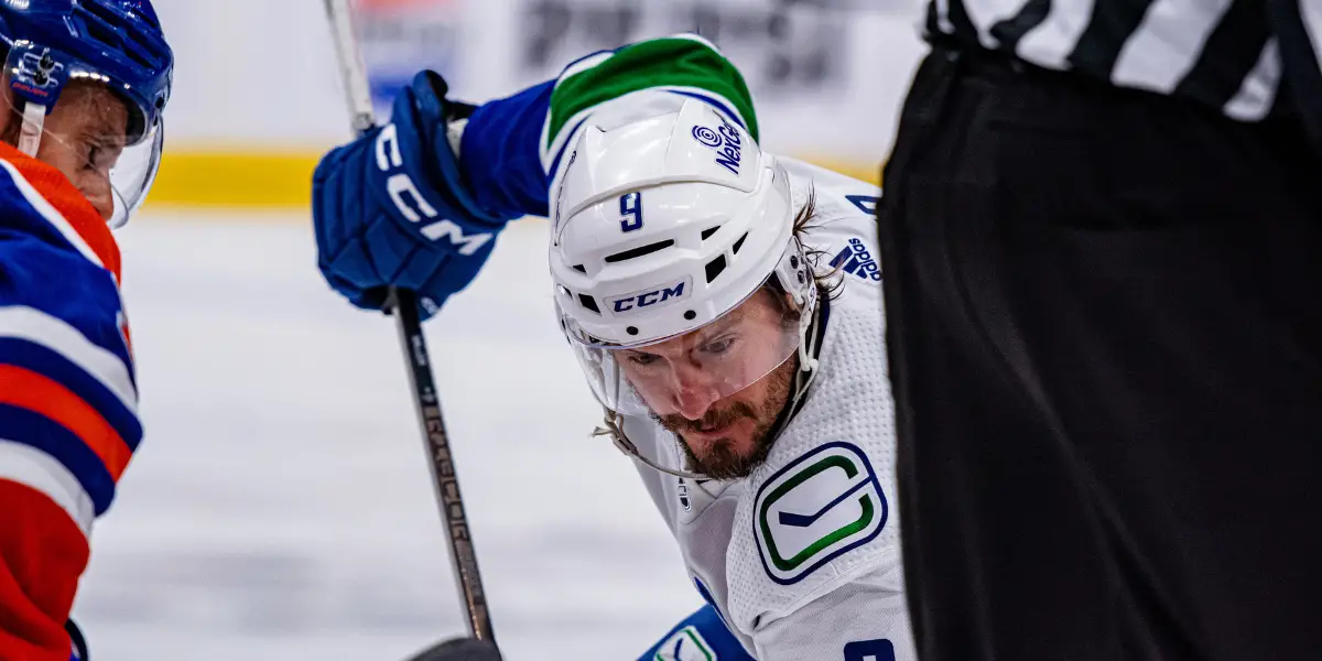 JT Miller at a faceoff for the Vancouver Canucks