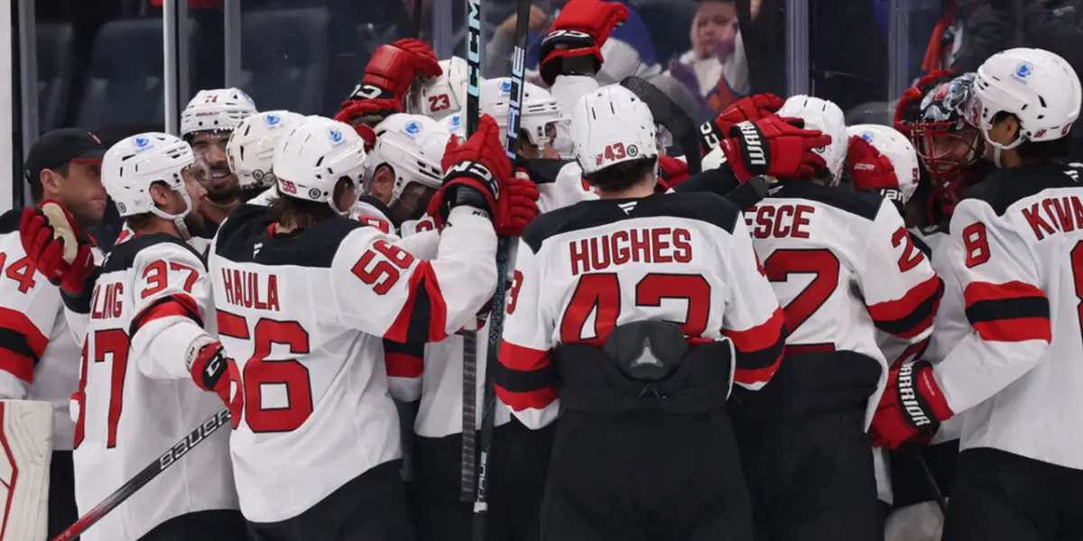 The New Jersey Devils celebrate an overtime victory against the New York Islanders.