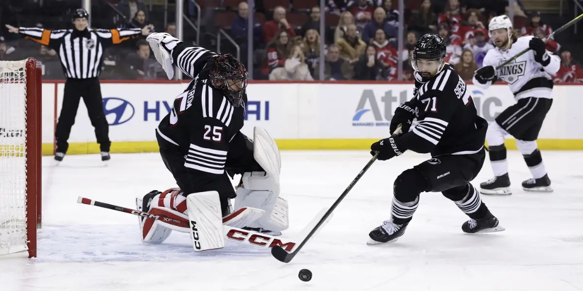 Jonas Siegenthaler clears the puck away from Jacob Markstrom against the Los Angeles Kings.