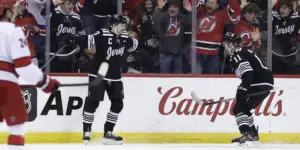 Nico Hischier and Stefan Noesen celebrate a goal in the first period against the Carolina Hurricanes.