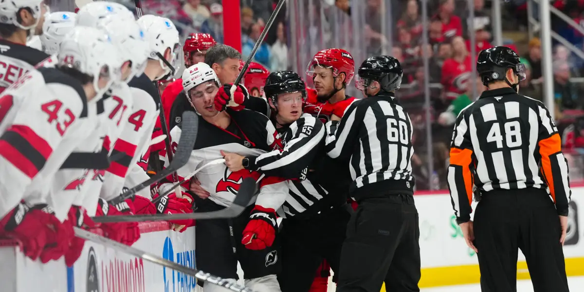 A scrum between the New Jersey Devils and Carolina Hurricanes following a big hit by Timo Meier on Martin Necas.