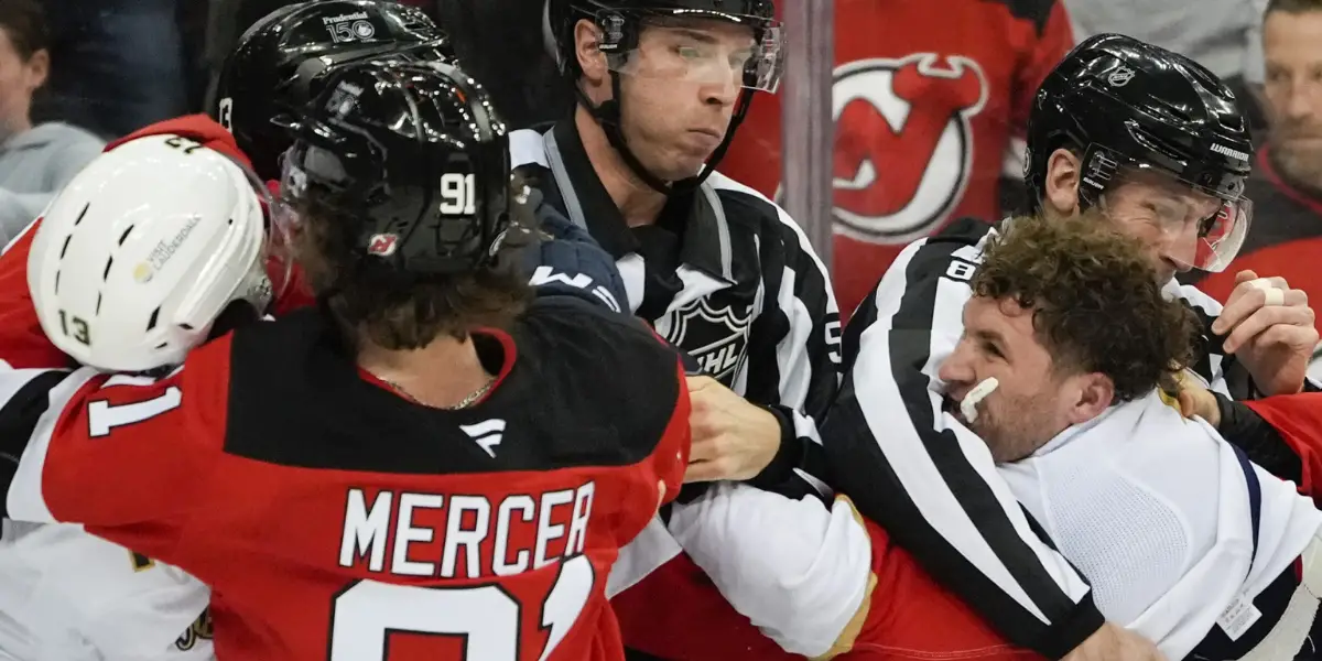 Dawson Mercer and Devils teammates go after Matthew Tkachuk following a hit on Nico Hischier.