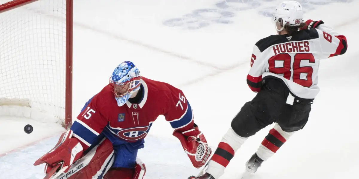 Jack Hughes scores the overtime winner on Jakub Dobes in Montreal.