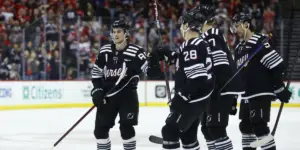 Jack Hughes celebrates his second-period goal with his teammates.