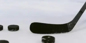 Hockey stick and pucks