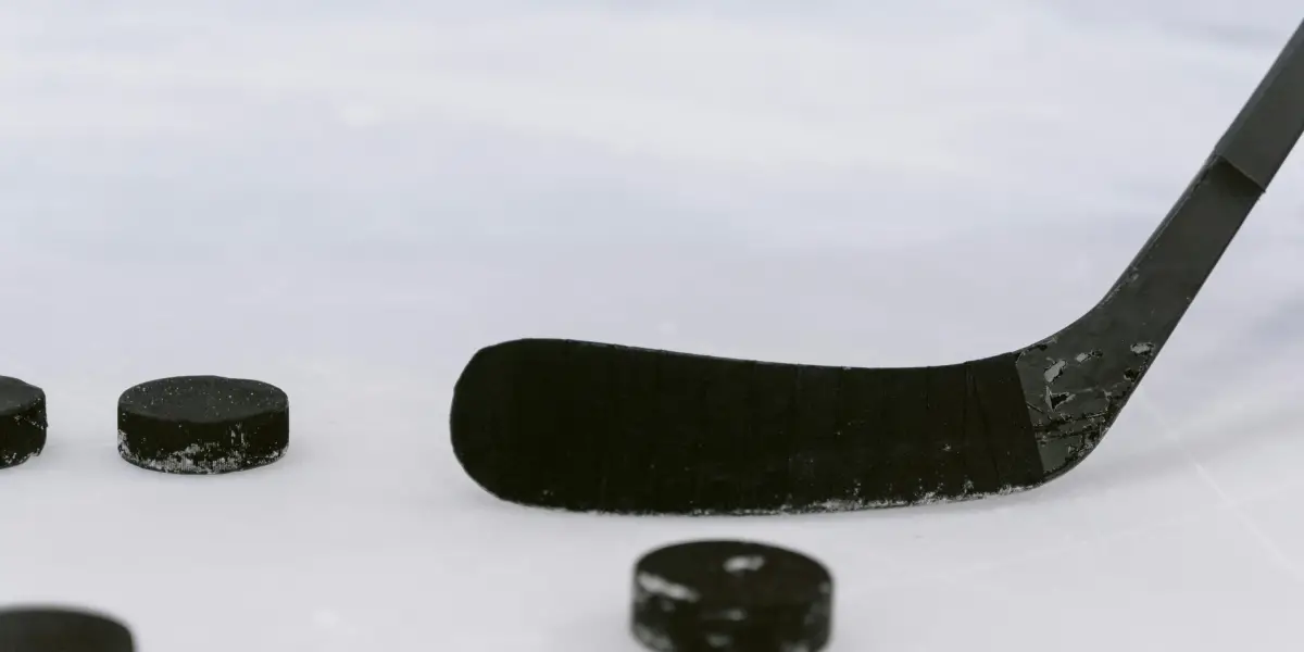 Hockey stick and pucks