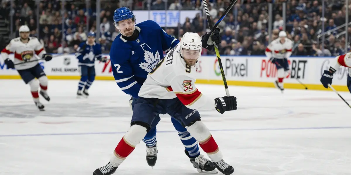 Bennett battles Benoit for the puck in the second period.