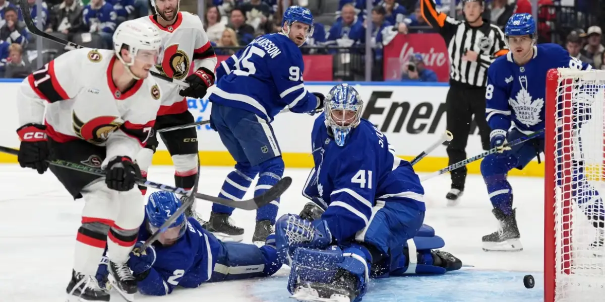 Ottawa Senators forward Ridly Greig scores a goal on Toronto Maple Leafs goaltender Anthony Stolarz as Simon Benoit tries to defend during the third period.