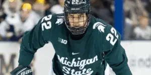 Isaac Howard skating for Michigan State Spartans