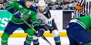 Forward Patrick Newell and Maine Mariners player going for the puck after a faceoff